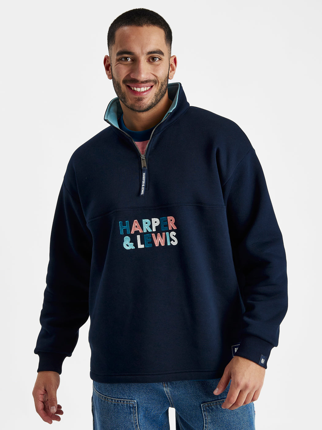 Mens sweatshirt featuring colourful embroidery and a contrasting blue inside collar.