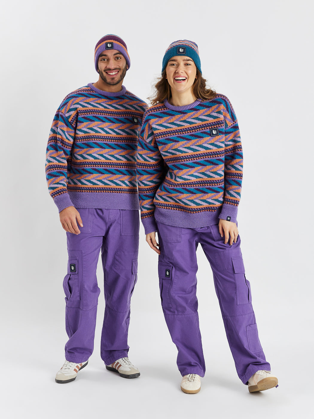 This jumper features a vibrant pattern in shades of Deep Lavender, Deep Purple, Petrol, and Apricot.