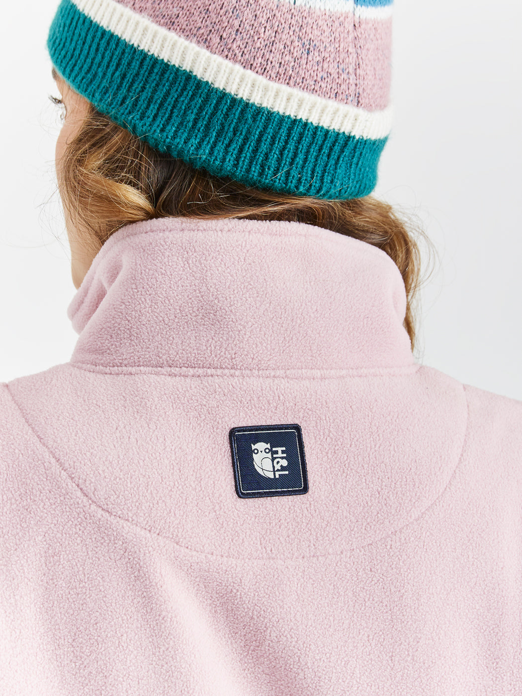 Womens pink fleece, Harper & Lewis branded badge featuring our classic logo.