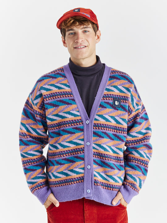 A woven branded badge at the chest and sleeve adds a signature touch to this class cardigan.