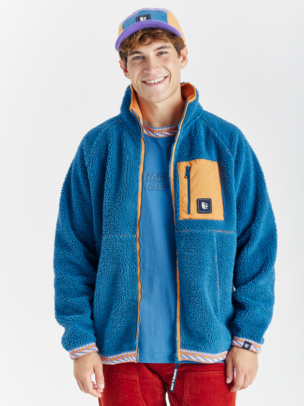 This Baylor sherpa fleece features a retro pattern tape on the hem and cuffs.