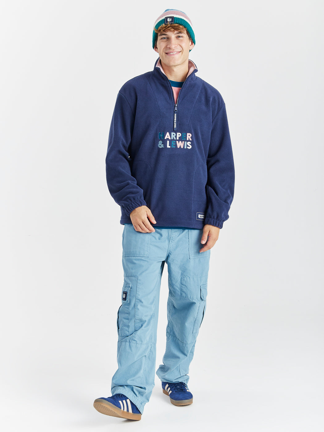 Navy detailing consists of, branded tabs on the pocket and sleeves, a woven badge on the back of the neck and a Branded zip puller on this cosy fleece.
