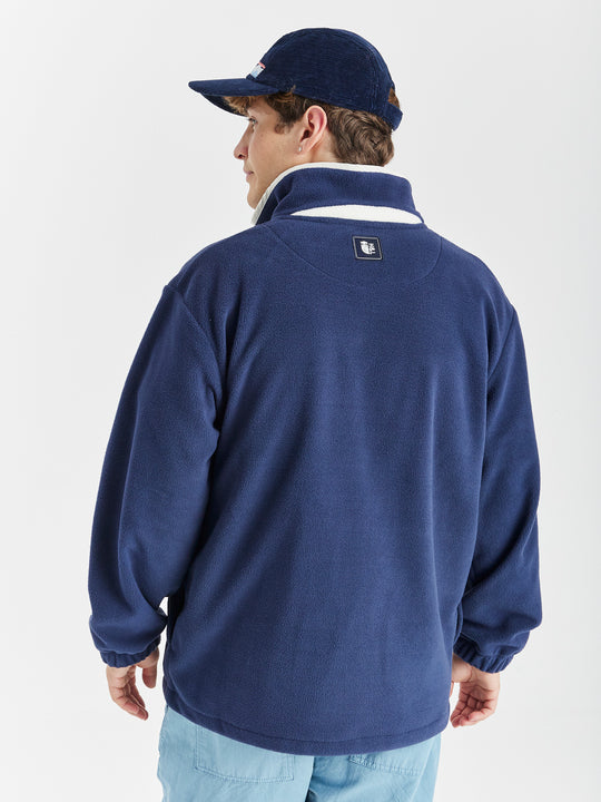 Inspired by a vintage fleece, this Navy fleece with cream details is a must-have item for your wardrobe. 