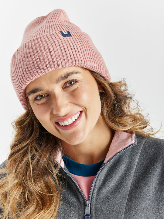 Add a pop of colour to your winter wardrobe with the Cervinia Beanie, a cosy woolly winter hat in a Rose shade.
