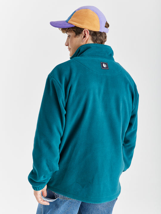 Comfort-fit Harper & Lewis Polar Fleece, with a relaxed silhouette, 1/4 zip collar, and soft fleece texture. Embroidered chest logo adds a refined touch.
