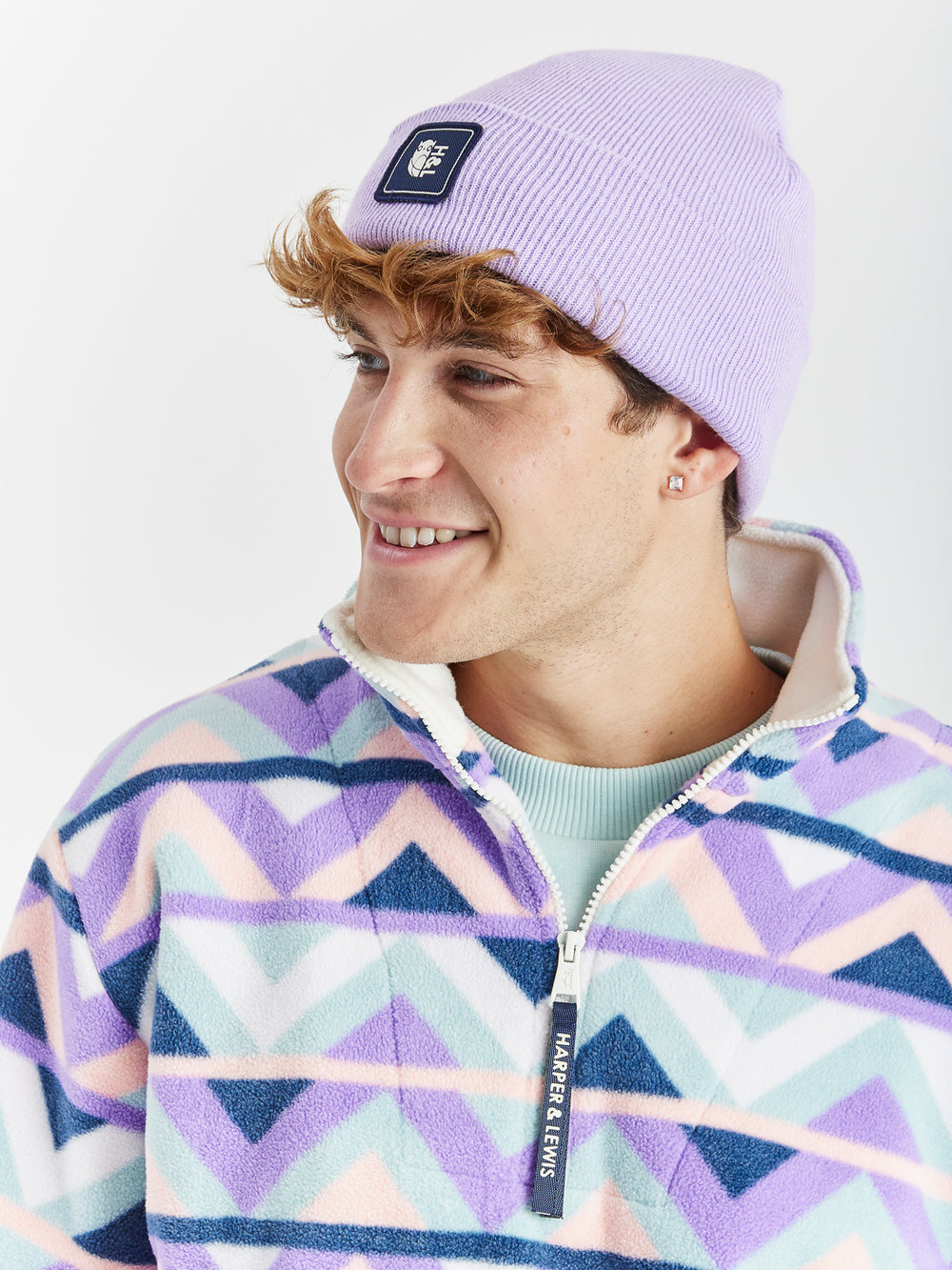 A cosy turn-up beanie in a Lavender shade, made from 100% acrylic.