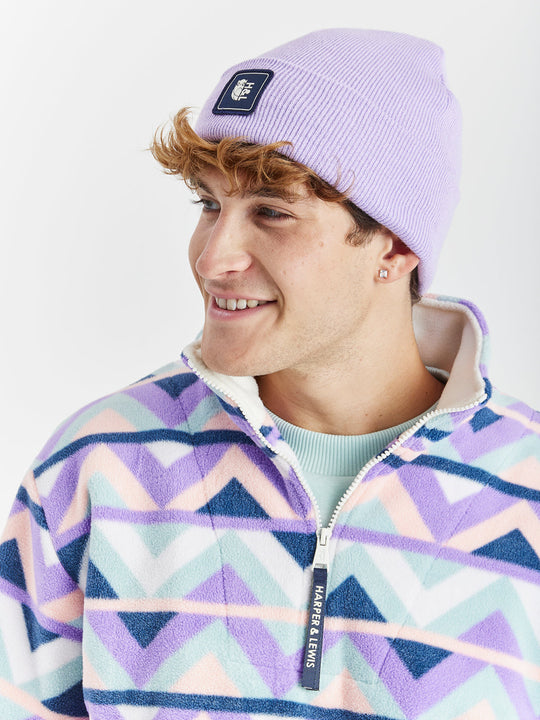 A cosy turn-up beanie in a Lavender shade, made from 100% acrylic.