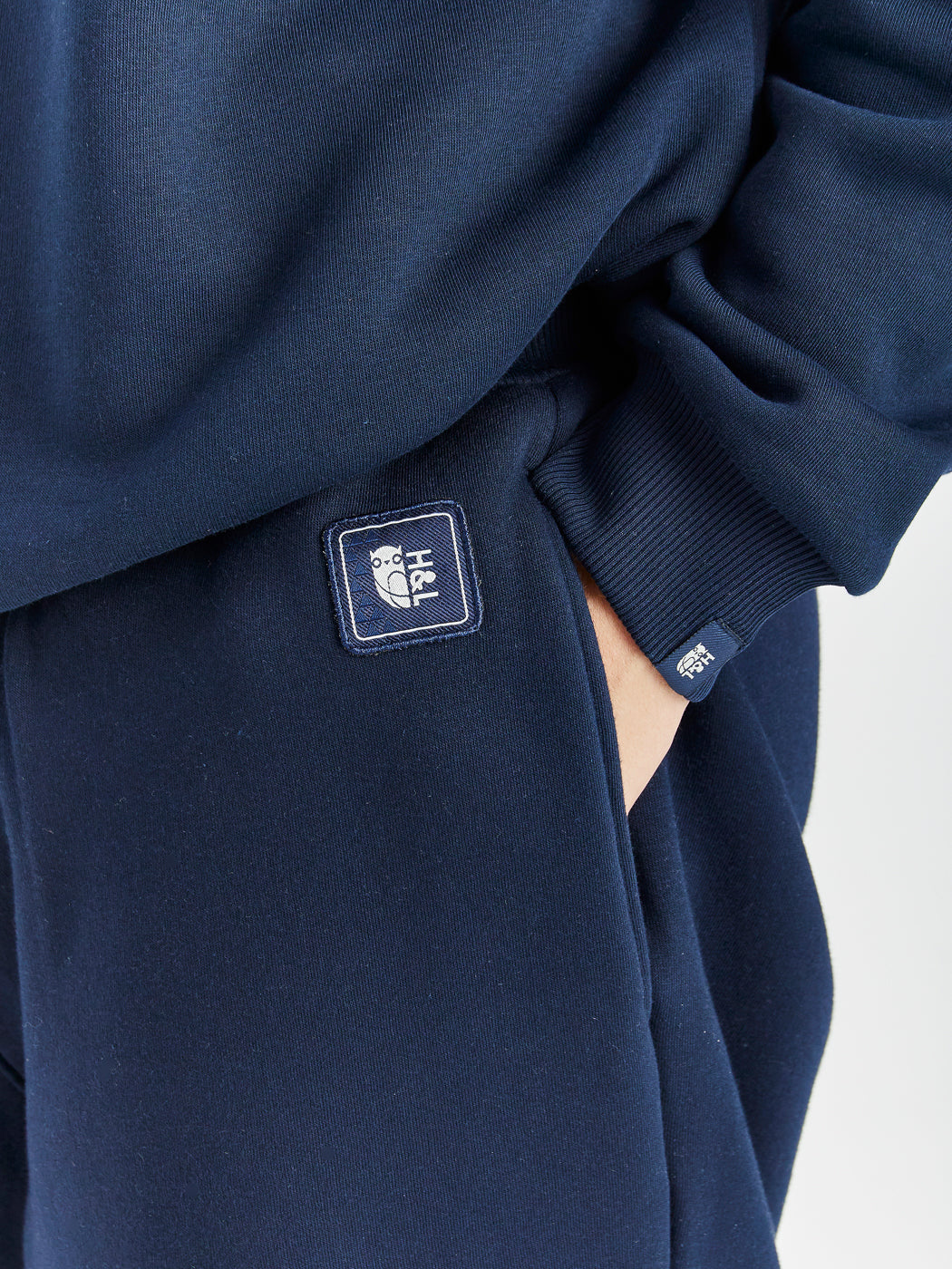 Branded Harper & Lewis badge in navy, on the waistband by the side entry pockets.