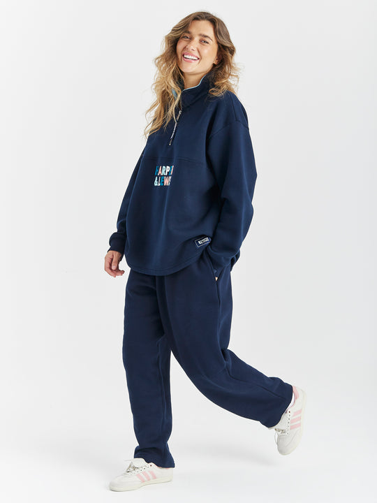 Match your Aya joggers with the Frankie 1/4 Zip sweater in navy.