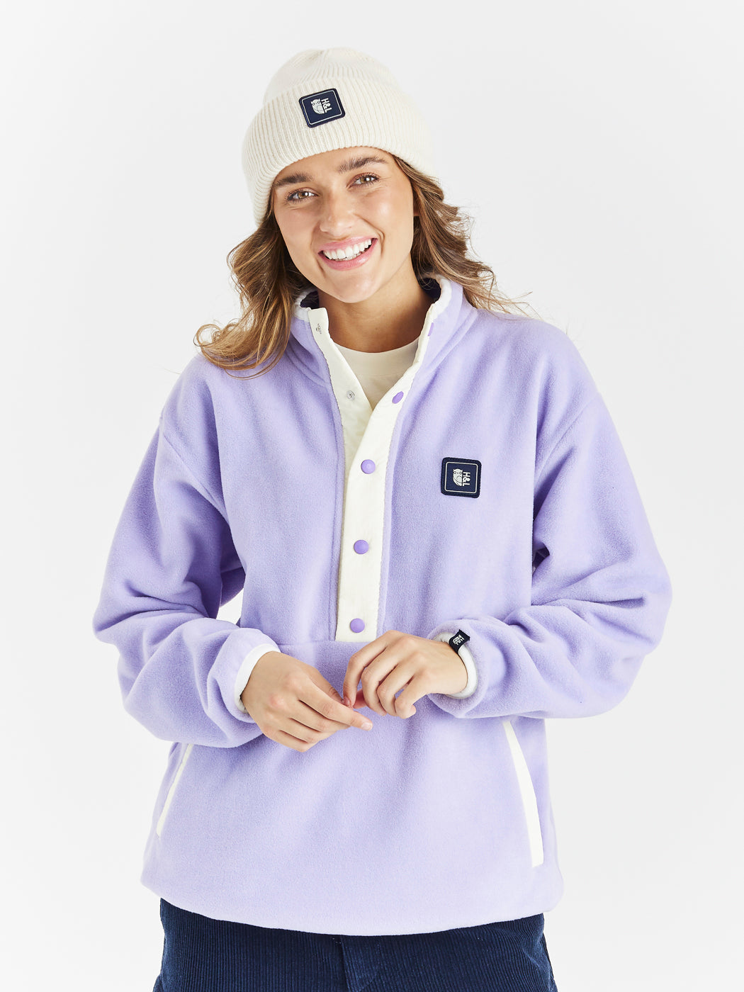 Oversized Popper Neck Retro Fleece with two side pockets and a drawcord hem.