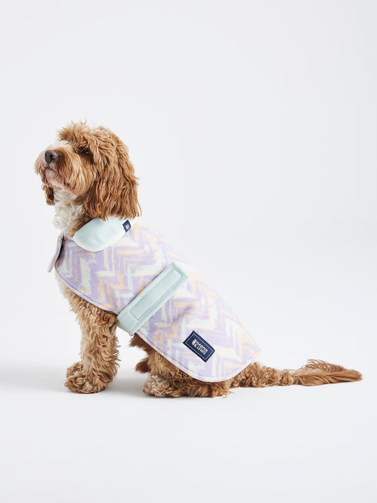 The Brook Dogs Retro Pattern Fleece, with a printed pattern in the colours of Pale Lavender, Peach and Cream.