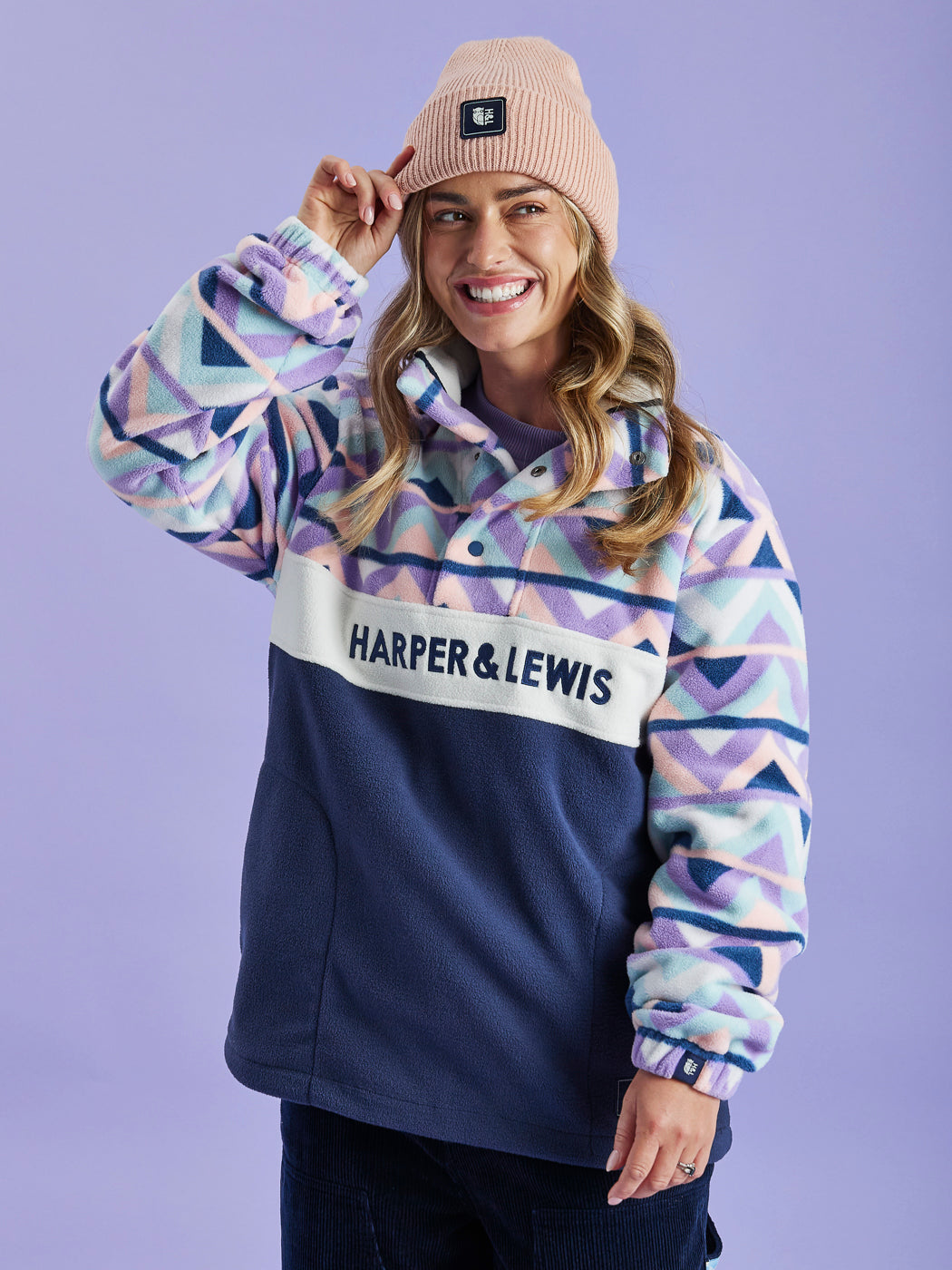 Branded popper buttons and blue embroidered Harper & Lewis on the chest of this Women's Fleece.