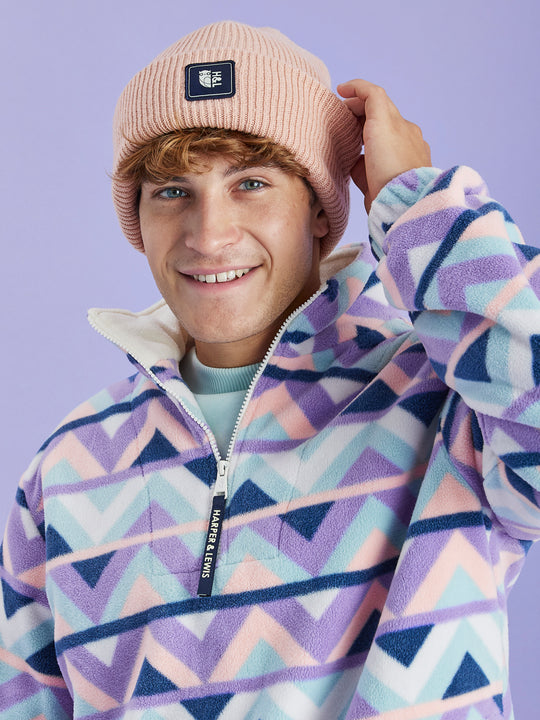 Crafted from 100% acrylic, this cosy turn-up beanie offers a soft and snug feel, perfect for keeping you comfortable during the colder months.