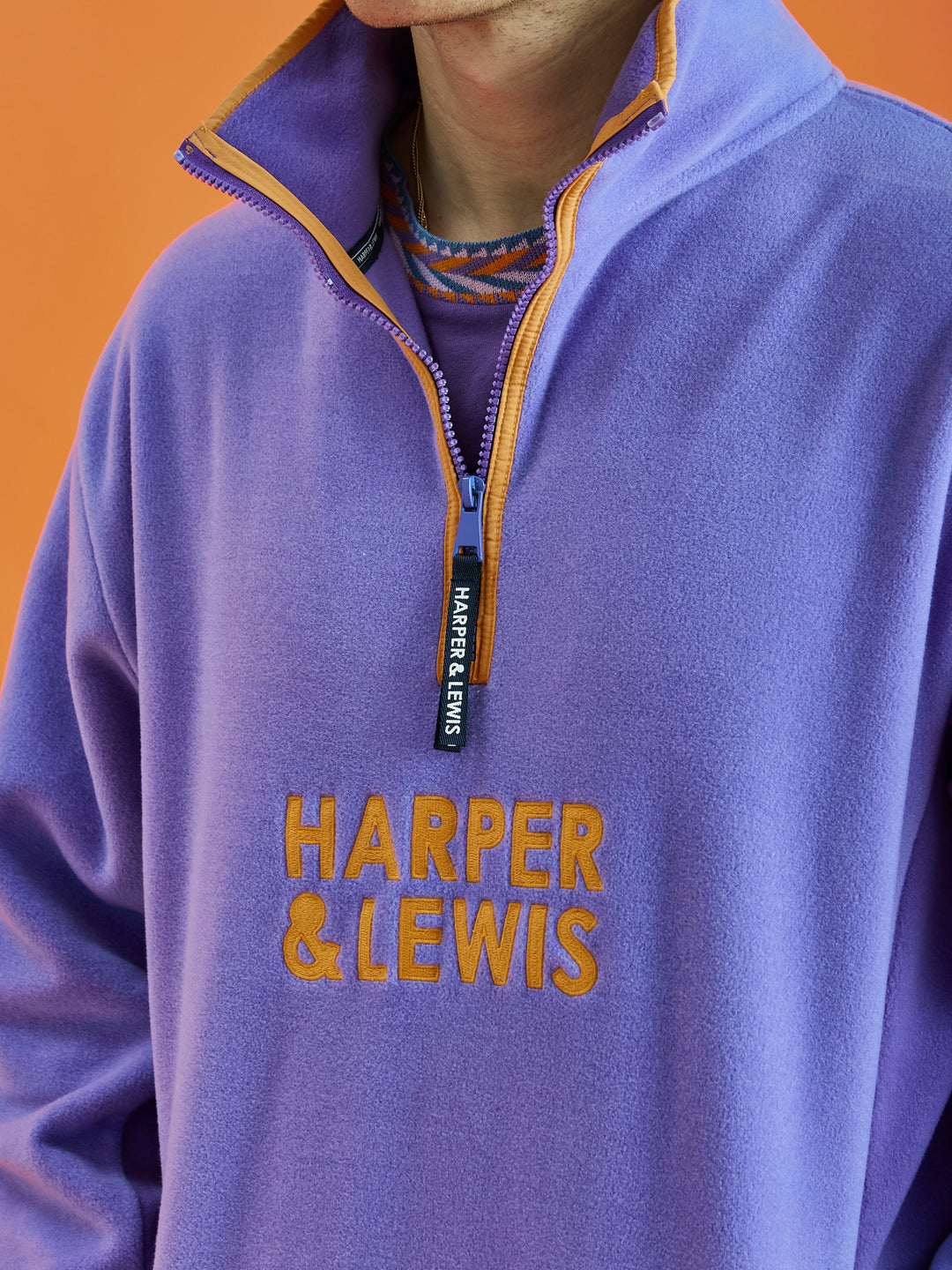 Brave the weather in this oversized polar fleece, with our classic orange stacked embroidery detail.