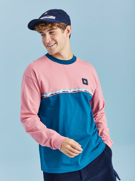 This crew neck t-shirt features a vibrant colour block design in Teal Green and Dusty Pink.