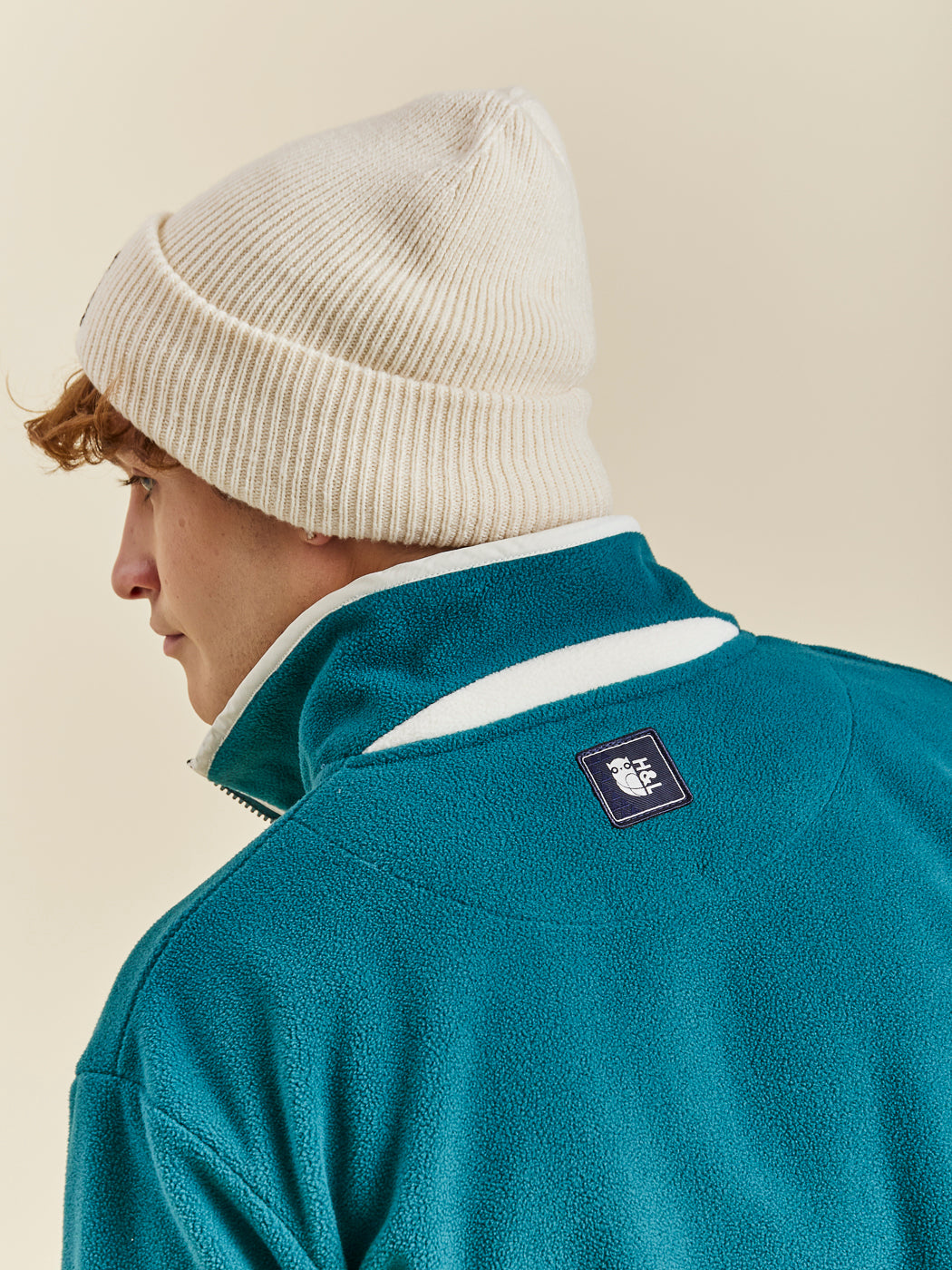 Comfort-fit Harper & Lewis Polar Fleece, with a relaxed silhouette, 1/4 zip collar, and soft fleece texture. Embroidered chest logo adds a refined touch.