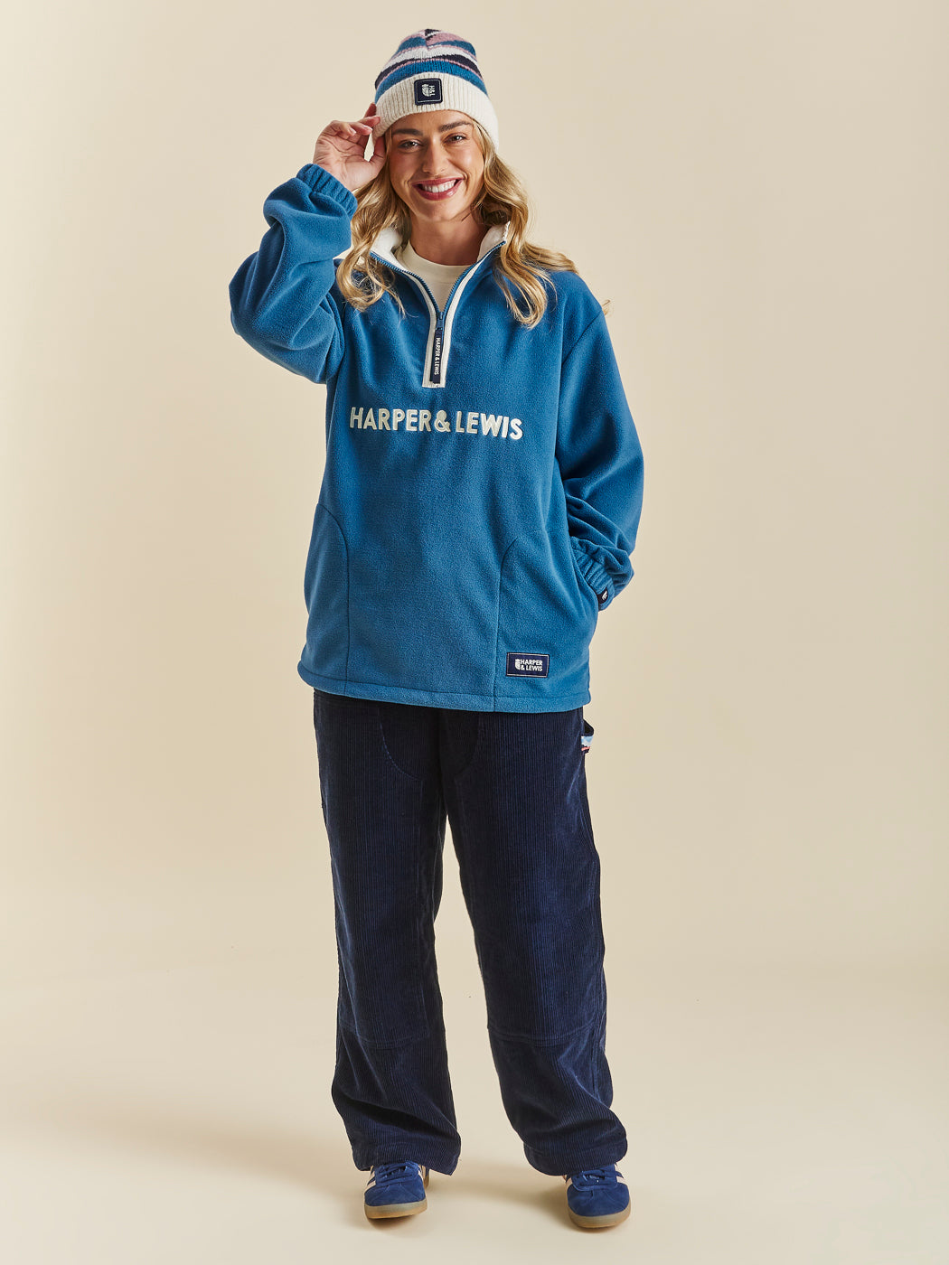 Comfort-fit Harper & Lewis Polar Fleece, with a relaxed silhouette, 1/4 zip collar, and soft fleece texture. Embroidered chest logo adds a refined touch.