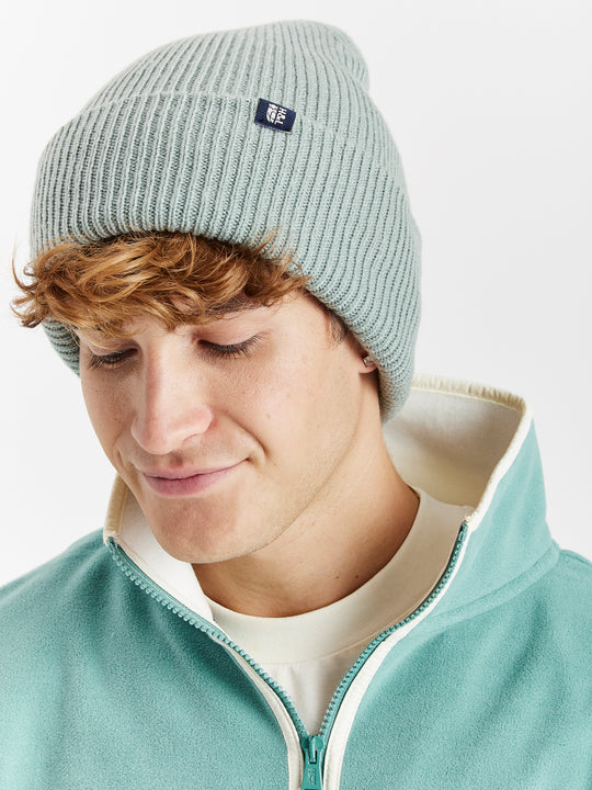 The classic design, featuring a ribbed turn-up brim, adds a stylish touch that pairs effortlessly with any cold-weather outfit.