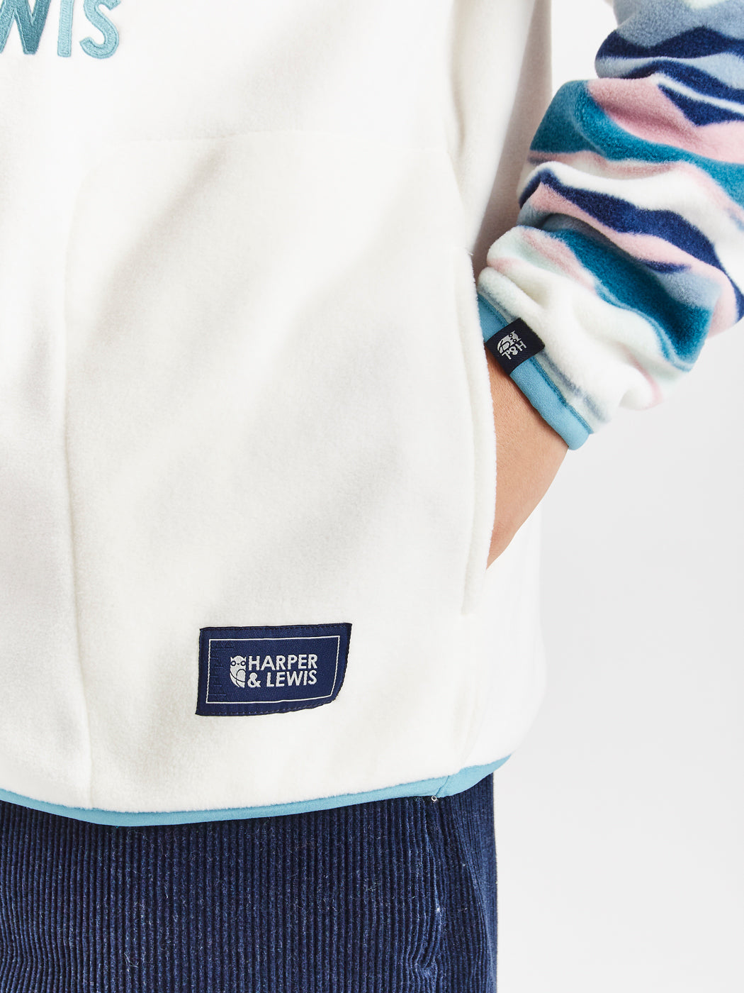 Subtle Harper & Lewis branded badges on both the pocket and the cuff of the sleeve.