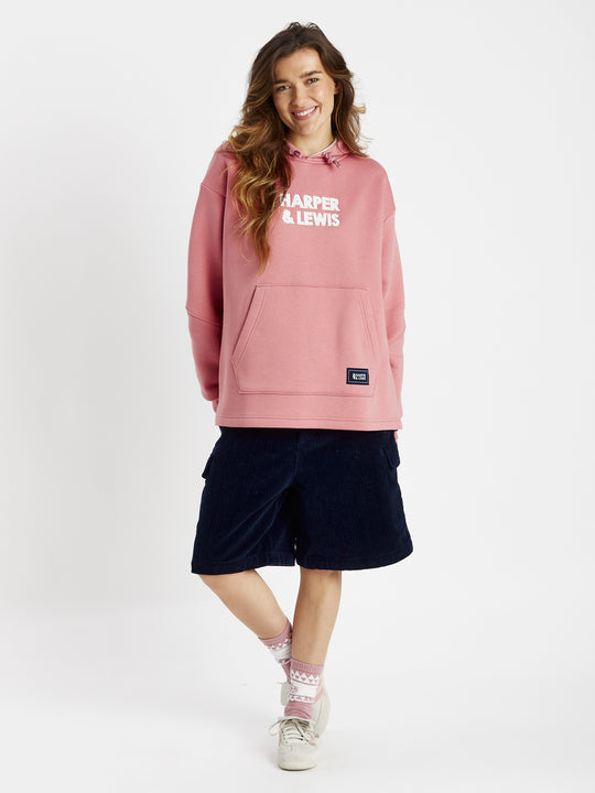 The model wears the Sweat Pea Hoodie in a casual look but this can be dressed up also.