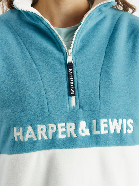 Navy detailing consists of, branded tabs on the pocket and sleeves, a woven badge on the back of the neck and a Branded zip puller on this cosy fleece.