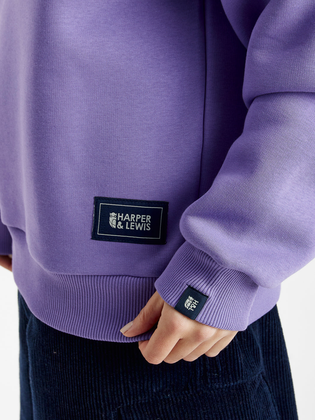 Branded Harper & Lewis tabs on the hem and the cuff of the unisex sweatshirt.