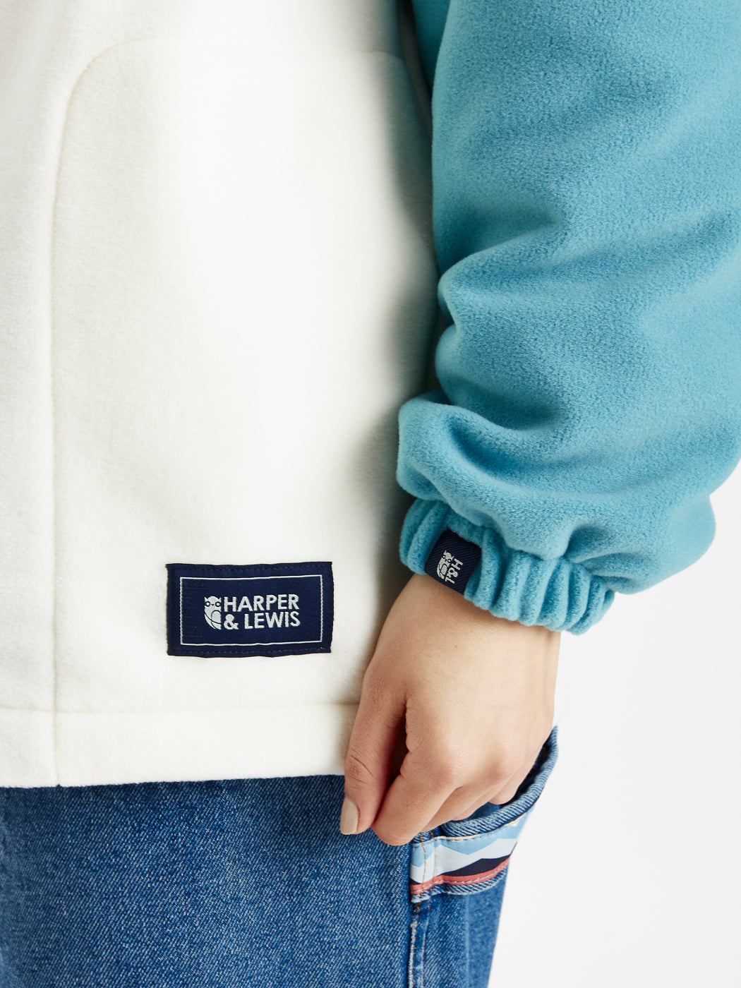 Quarter zip with Navy branded zip pull, with cream embroidered Harper & Lewis Logo, adding subtle details to warm fleece.
