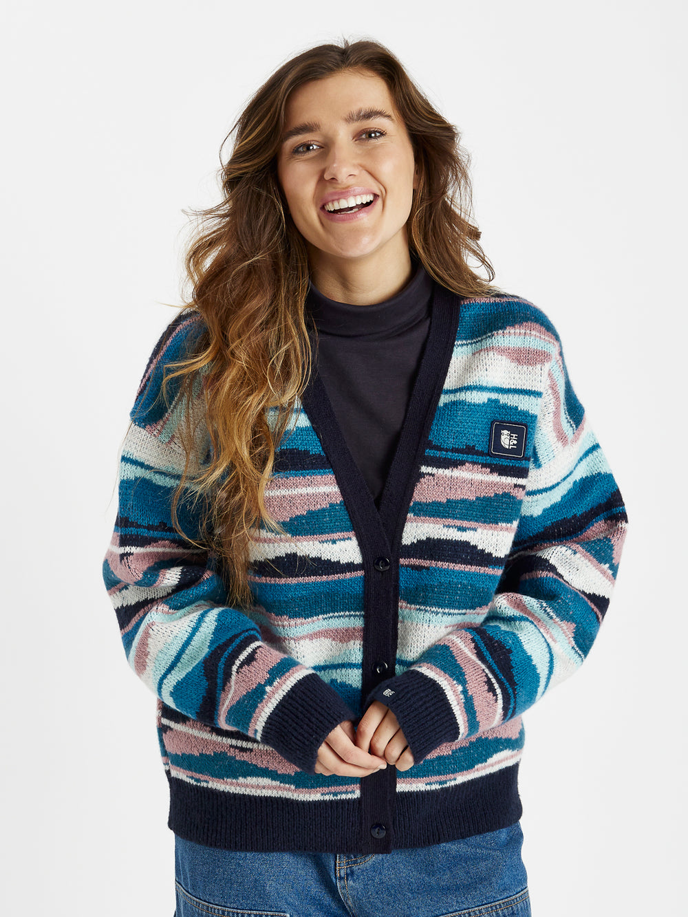 The cardigan features contrast ribbed cuffs, neckline, and hem in navy.