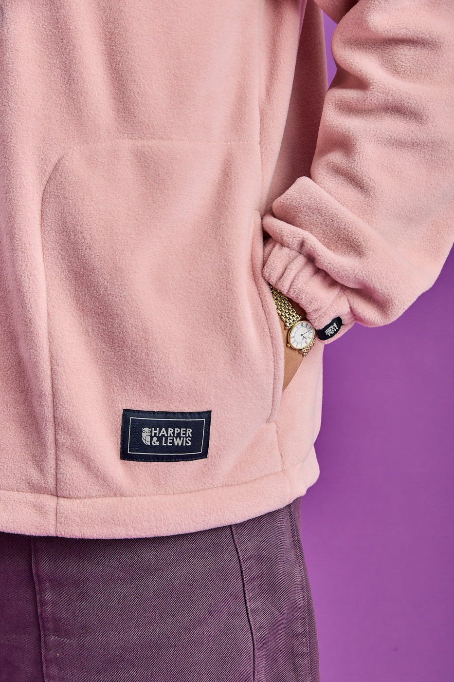 Detailed shot of the side entry picket detailing the navy woven patches on the pocket and the cuff.