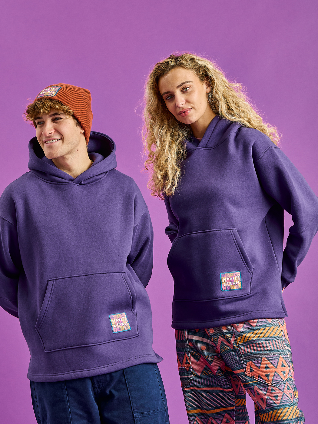 Both Models wearing the Indiana Hoodie in Purple.