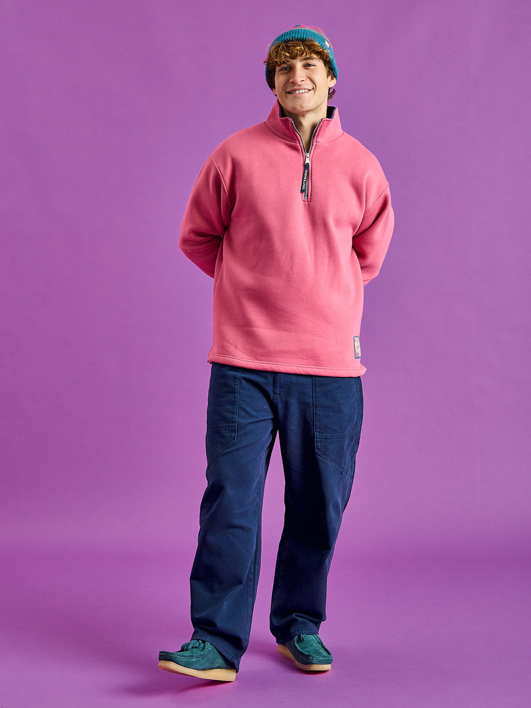 Male Model wears the Fable 1/4 zip sweatshirt. Which is a modern take of a timeless classic.