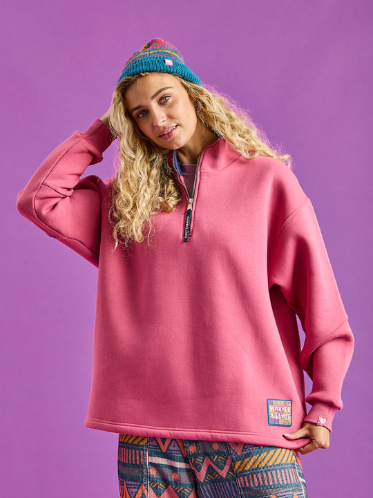 Female Model wears the Fable 1/4 Zip Sweater in Dark Rose.