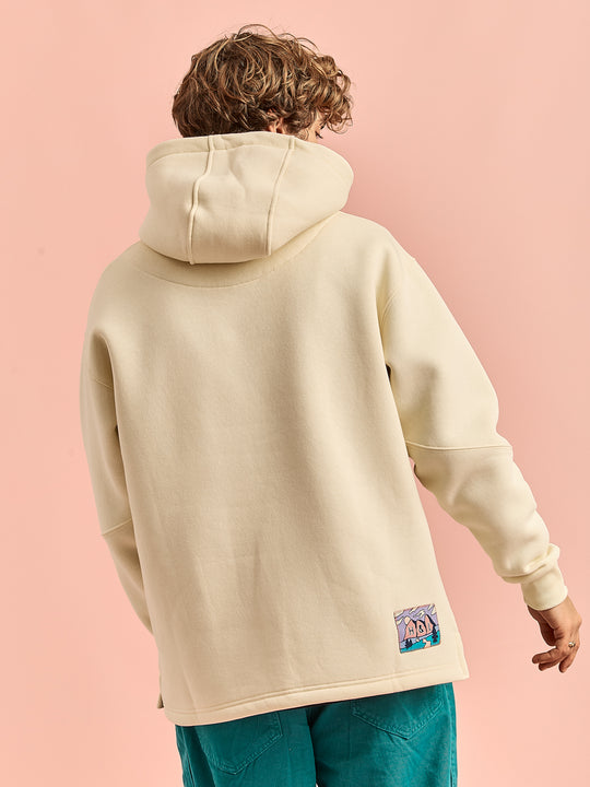 Back shot of the model wearing the hoodie, showing the oversized hood.