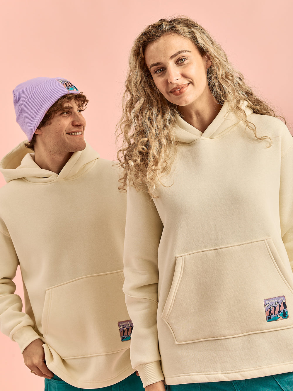 Female & Male model both wearing the Willow hooded sweater, the perfect layering piece