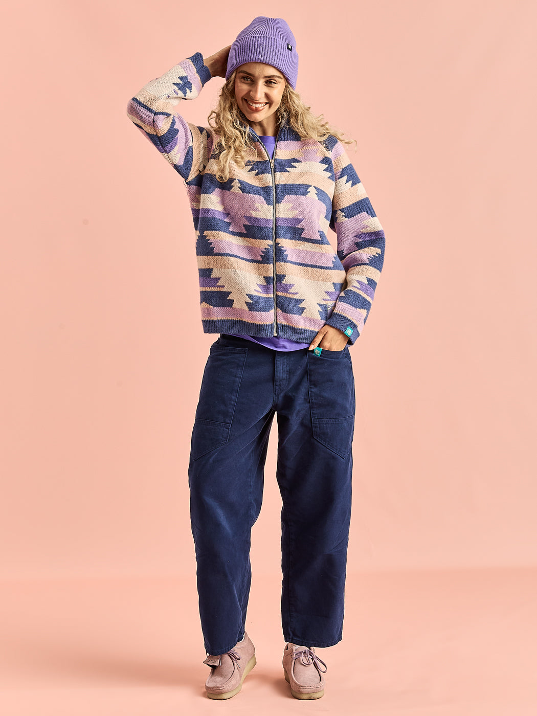 Female Model wears the Knitted Cardigan which offers a slouchy fit, perfect for those who love a relaxed and comfortable style.