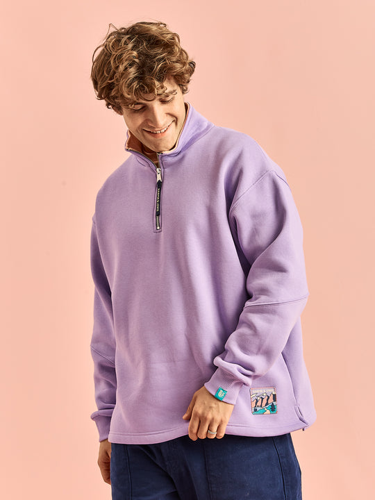Male Models wears the Obi 1/4 zip sweater which features a released hem for maximum comfort.