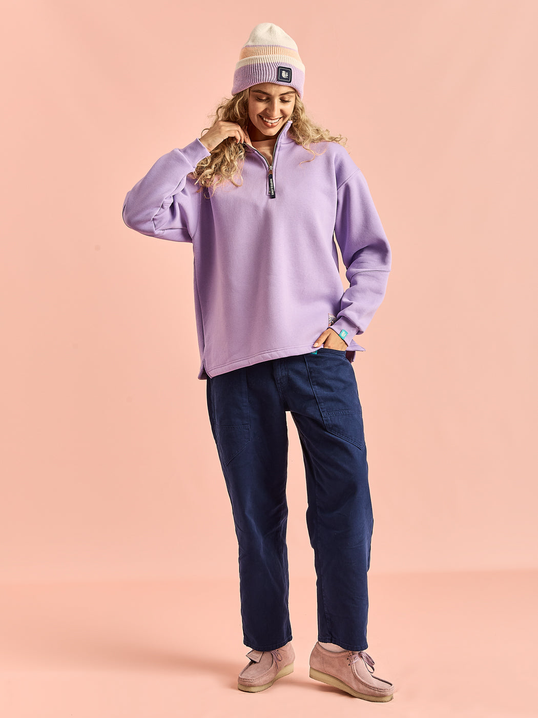 The Obi sweater is a classic staple, with subtle hits of branding