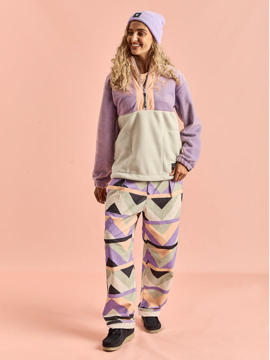 Female model wearing the Ezra trousers which features two front pleats