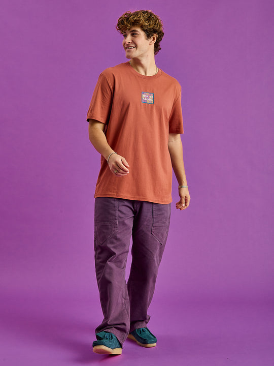 Male Model wears our Fable t-shirt featuring a branded badge
