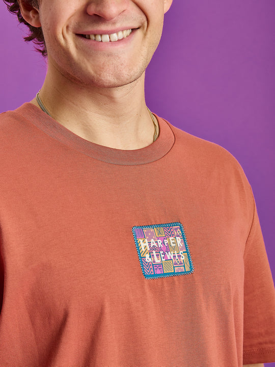 Detail shot of the branded aztec inspired badge attached with a zigzag stitch