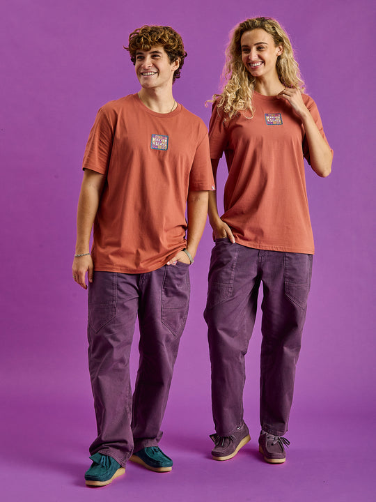 Both Models wearing the Fable t-shirt styled with the deep mulberry trousers