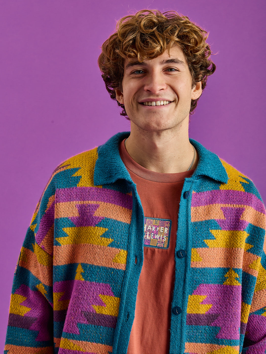 Male Model wears the Knitted cardigan which is made in the UK.