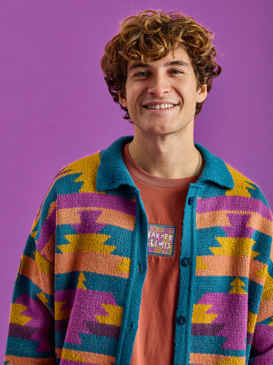 Male Model wears the Knitted cardigan which is made in the UK.