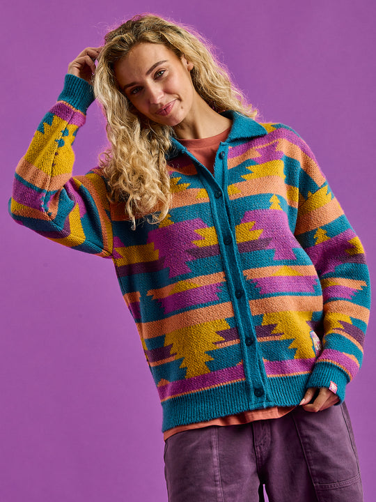 Female Model shows the slouchy cardigan with the buttons done up.