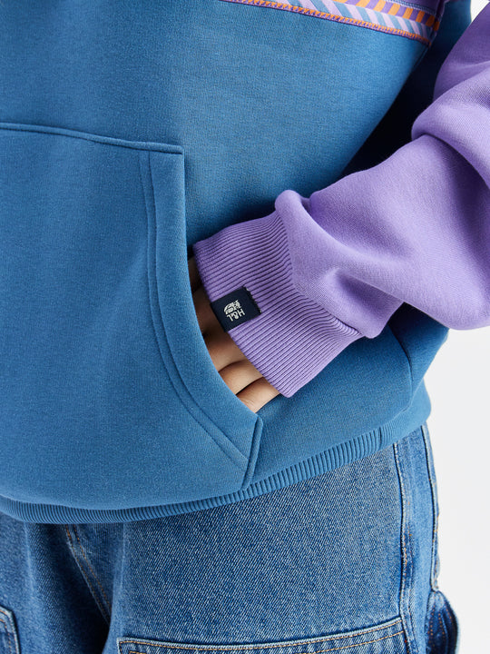 The sweatshirt being oversized makes for a more relaxed fit.