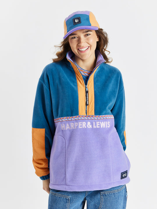 Womens fleece with Apricot crinkle woven plackets on the sleeves and along the 1/4 zip.
