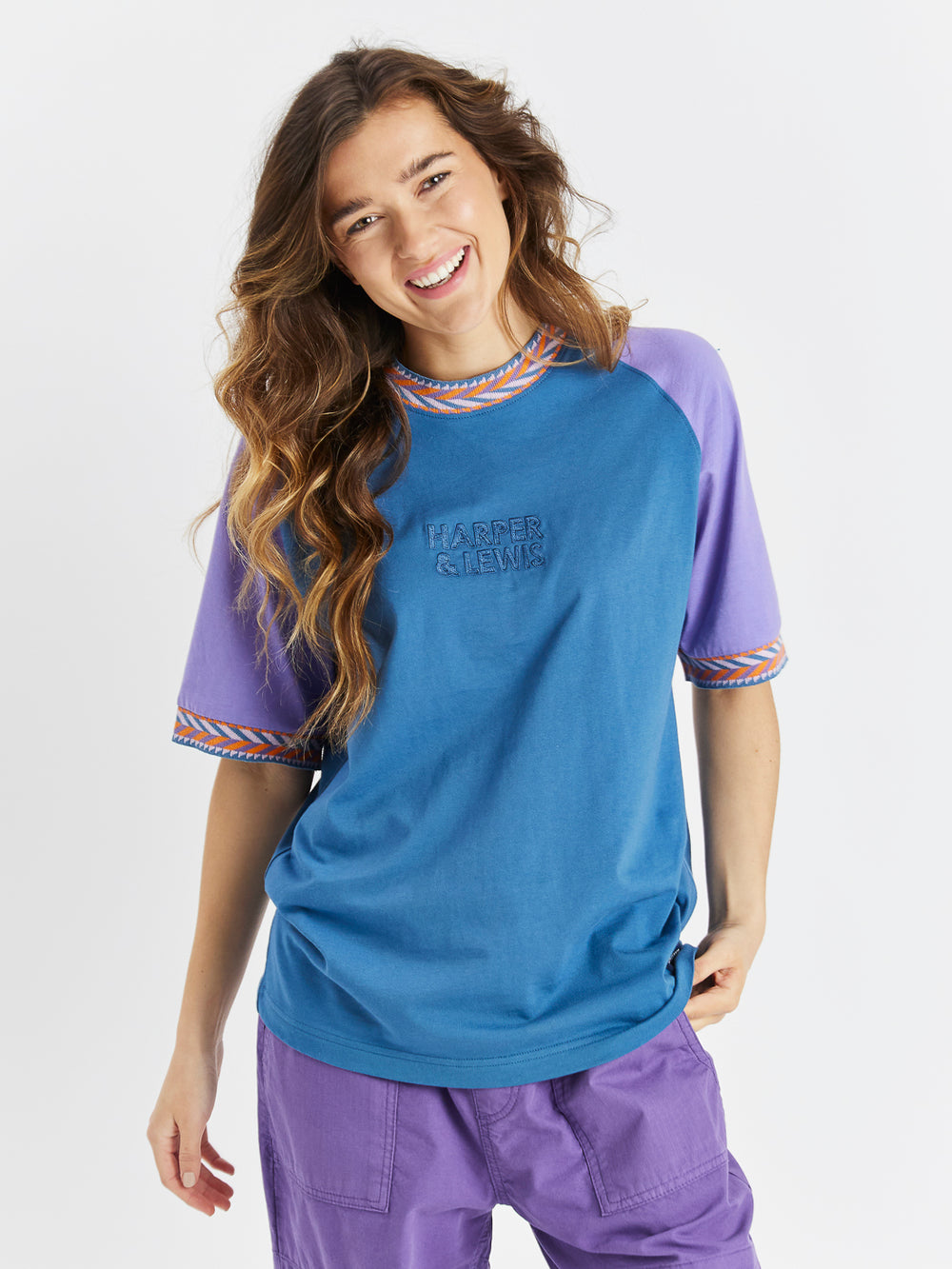 This t-shirt features a retro pattern on the collar and sleeves.