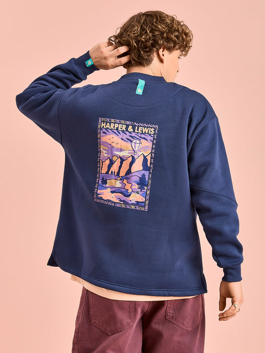 Back shot of the Atlas sweater in navy, which features a retro mountain inspired back print.