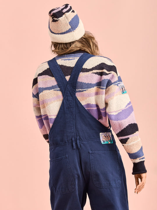 Back shot of the workwear style dungarees, this features belt loops and a crossed straps