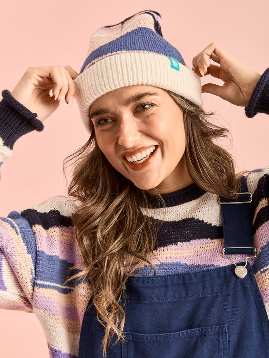 The beanie includes a Harper & Lewis woven badge in navy, offering a classic look.